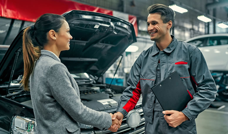 Photo of mechanic repairing a car