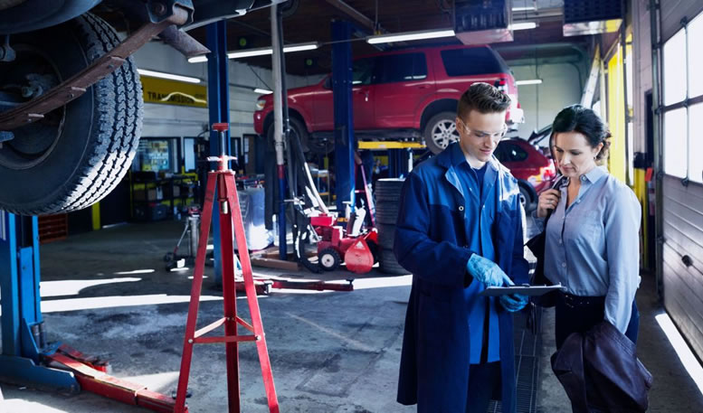 Photo of mechanic repairing a car